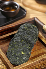 Organic Shredded Kelp Cakes from Dalian - Traditional Asian Seaweed Food Ingredient in Wooden Basket