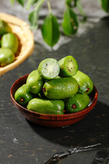 Fresh Small Kiwi Berries in Wooden Bowl - Healthy Organic Fruit Snack