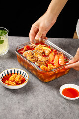 Spicy Seafood Hot Pot with Shrimp and Shellfish in Red Chili Sauce - Traditional Asian Cuisine Preparation