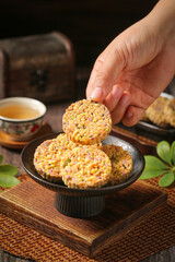 Mixed Grain Rice Cakes with Purple Potato and Savory Ingredients on Rustic Wooden Serving Board
