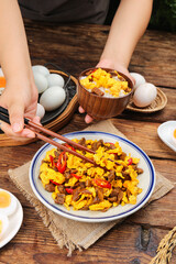 Scrambled Duck Eggs with Dried Radish and Fresh Vegetables on Rustic Wooden Table