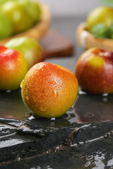 Fresh Ripe Mangoes with Water Droplets on Dark Surface - Tropical Fruit Photography