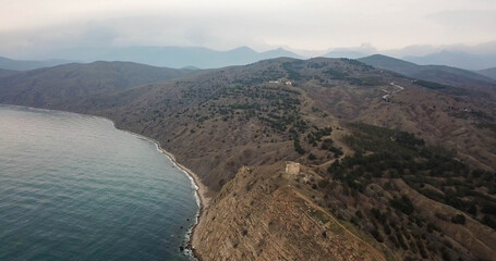 Ancient tower on a mountain near the sea 