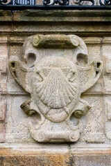 Pilgrim’s shell carved in stone on a building in Santiago de Compostela – Symbol of the Camino de Santiago
