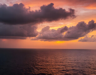 Fototapeta premium Amazing sunset on the sea of black and white clouds. A sunset at the beach.