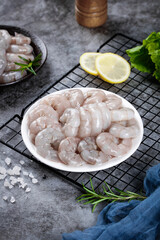 Fresh Raw Prawns with Lemon and Herbs on Stone Kitchen Counter