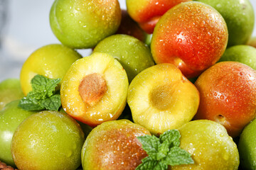 Fresh Cut Plums with Mint Leaves - Juicy Stone Fruit Collection