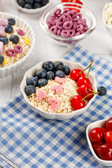 Healthy Oatmeal Breakfast Bowl with Fresh Berries and Cherries Ready to Eat