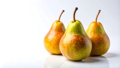 Three ripe pears displayed against a plain white background, showcasing their vibrant yellow and reddish hues, and subtle pear-shaped textures.