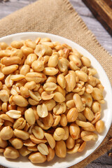 Bowl of Salted Roasted Peanuts Ready to Eat Healthy Snack Food on Wooden Table