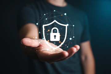 Person holding a glowing shield with a padlock symbol representing data security