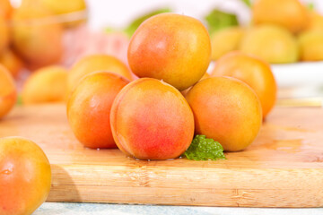 Fresh Xinjiang Apricots with Red Blush on Wooden Board - Organic Summer Stone Fruit
