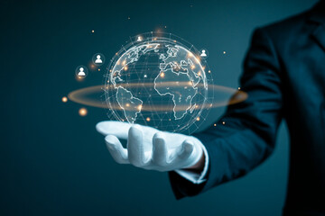 Businessman holding a digital glowing globe representing global communication and connectivity