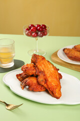 Spiced Crispy Fried Chicken Wings with Fresh Cherries Table Setting