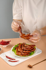 Marinated Duck Feet with Spicy Sauce - Traditional Asian Snacks Preparation by Chef in Kitchen