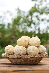 Golden Homemade Bread Rolls Collection in Wicker Basket on Rustic Wooden Table