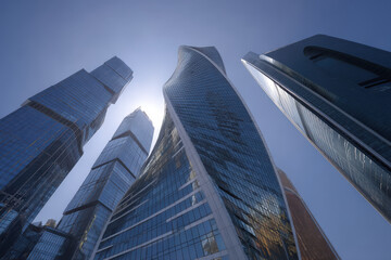 futuristic skyscrapers rise majestically against clear blue sky creating stunning architectural ensemble