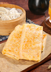 Handmade Golden Potato Pancakes with Shredded Filling and Steamed Dumplings Traditional Asian Cuisine