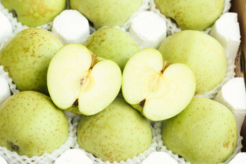 Fresh Green Apples from Shaanxi Province China with Cut Halves Showing Interior