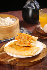 Handmade Asian Potato Pancakes with Spicy Shredded Filling and Traditional Tea Service