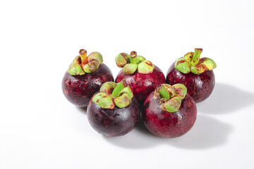 Fresh Purple Mangosteen Thai Tropical Fruits with Green Leaves on White Background