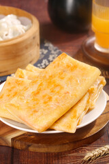 Handmade Golden Potato Pancakes with Traditional Bamboo Steamer Breakfast Setting