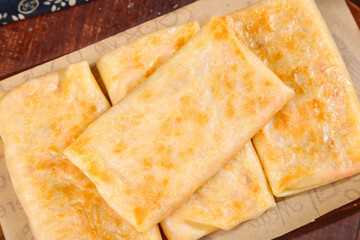 Handmade Golden Potato Pancakes with Crispy Bottom on Wooden Board