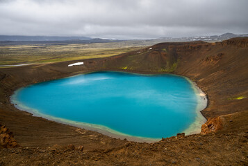 A stunning crater lake with deep blue water. © Tom