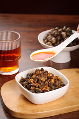 Spicy Whelk Stirfry Korean Seafood Dish with Chili Oil Sauce on Wooden Board
