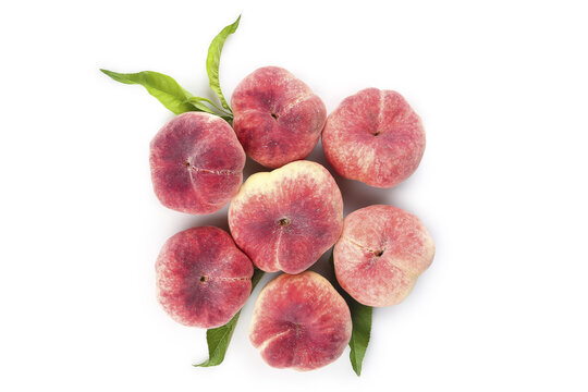 Fresh Shaanxi Flat Donut Peaches with Leaves on White Background - Chinese Queen Mother Fruit