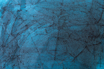 Crumpled blue paper tissue smudged with charcoal , abstract patterned backdrop