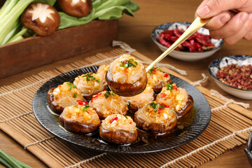 Steamed Mushrooms Stuffed with Fresh Garlic Vermicelli Noodles Served Hot on Plate with Chopsticks