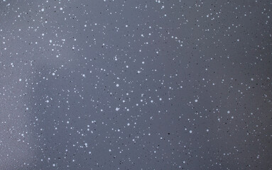 Gray ceramic coating with black and white dots on a pan or pot, abstract close up texture new kitchen utensil concept