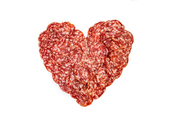 Heart shape made with salami slices , close up isolated on white background