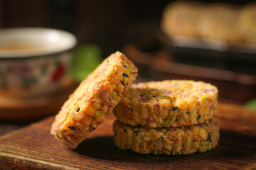 Homemade Mixed Grain Pastry Cakes with Purple Vegetables and Roasted Ingredients on Wooden Board