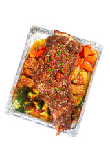 Roasted Leg of Lamb with Vegetables in Foil Tray on White Background