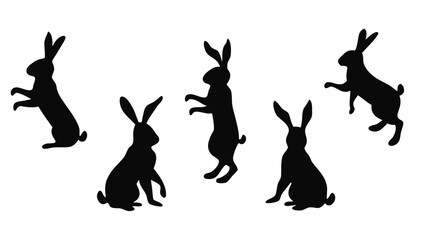 Collection of black rabbit silhouettes in various poses on a white background