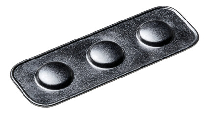 Close up of a metal plate with three raised circular shapes on a white background