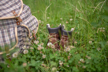 Backpack and hiking boots in forest