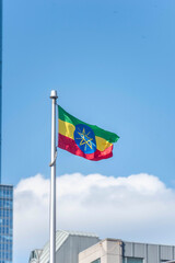 The Ethiopian flag on a flag pole at Toronto City Hall’s Nathan Phillips Square.