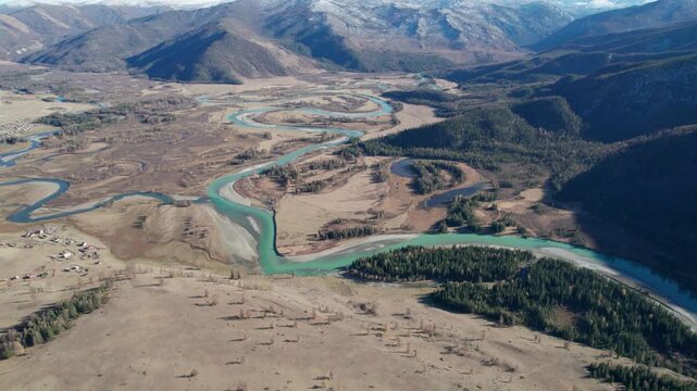 Panoramic aerial view of autumn Altai mountains and Argut river captured near Beliashi village by a drone