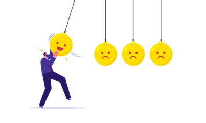 Happiness, optimistic, balance between happiness and sadness, businessman holding smile face pendulum ball to hit other sad faces