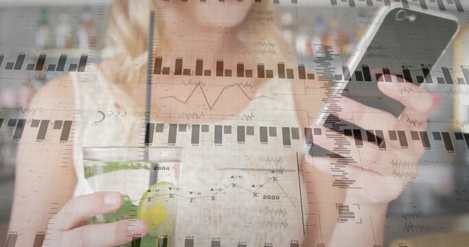 Sipping adult woman holding smartphone and analyzing overlay charts in kitchen, with smoothie jar - Powered by Adobe