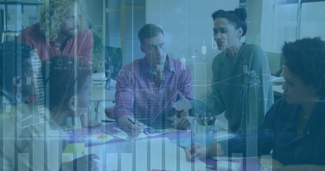 Team members discussing plan at conference table, pointing at charts and using markers for analysis