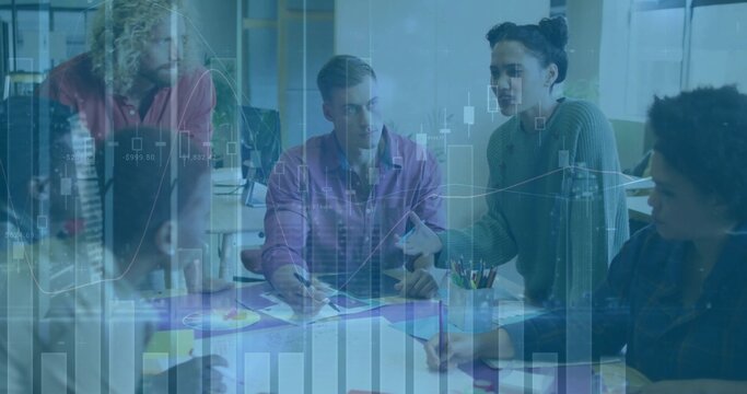 Team members discussing plan at conference table, pointing at charts and using markers for analysis