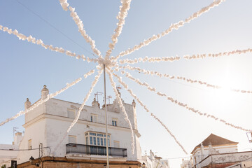 Conil de la Frontera, Cadiz, Andalusia, Spain. 6 September 2025. Whitewashed building with festival decorations