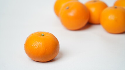 Isolated white Wokam Orange or often known as Mandarin Orange which is still fresh with bright orange skin.