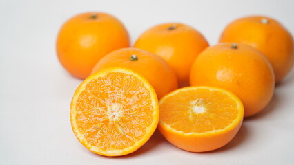 Isolated white Wokam Orange or often known as Mandarin Orange which is still fresh with bright orange skin.
