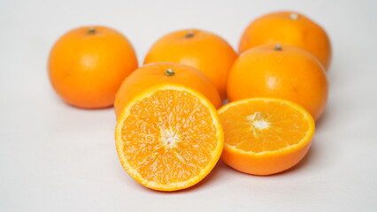 Isolated white Wokam Orange or often known as Mandarin Orange which is still fresh with bright orange skin.