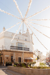 Conil de la Frontera, Cadiz, Andalusia, Spain. 6 September 2025. Whitewashed building with festival decorations